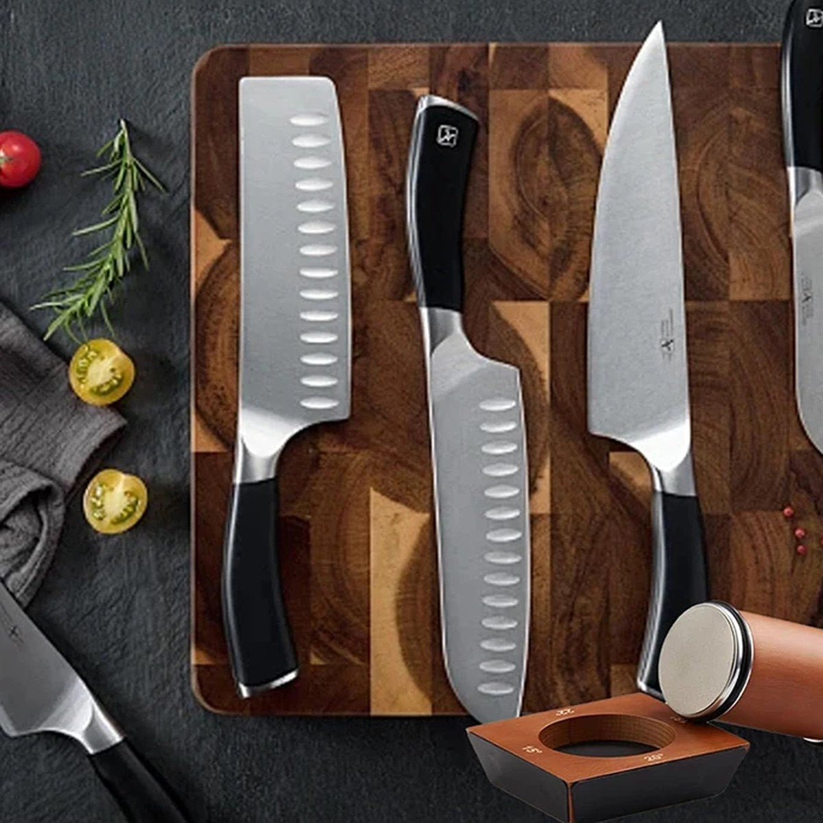 Roller knife sharpener and kitchen knives on a board